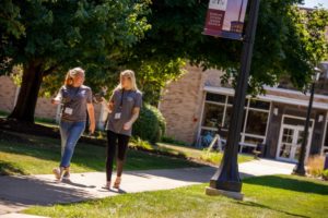 Two females walking on campus in 2019