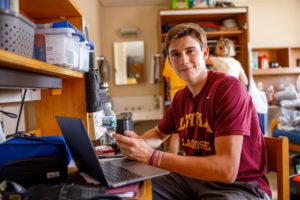 Male student on a computer