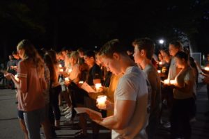 Students in prayer outdoors