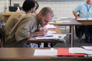 Male student working at the prison in the MCI program