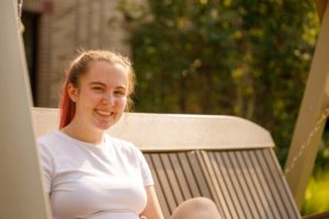 Female student sitting on a bench