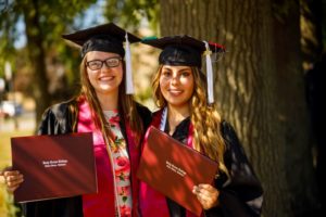 Two female students at graduation 2020