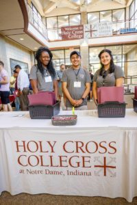 Three students working at registration