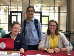 Three female students helping with fundraising