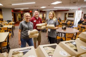 Students getting boxed lunches