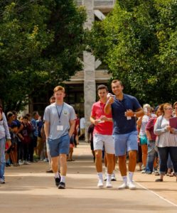 Male students walking around campus