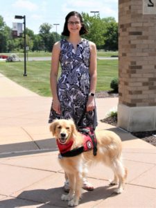 Emma Bleasdale pictured with service dog Costello