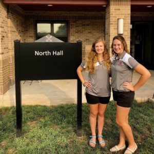 Pictured are Marie Oliva and Katie Luczak in front of North Hall
