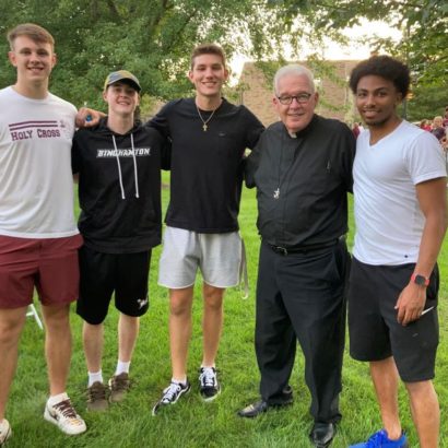 Father Tyson with students at the HoCro Nation celebration.
