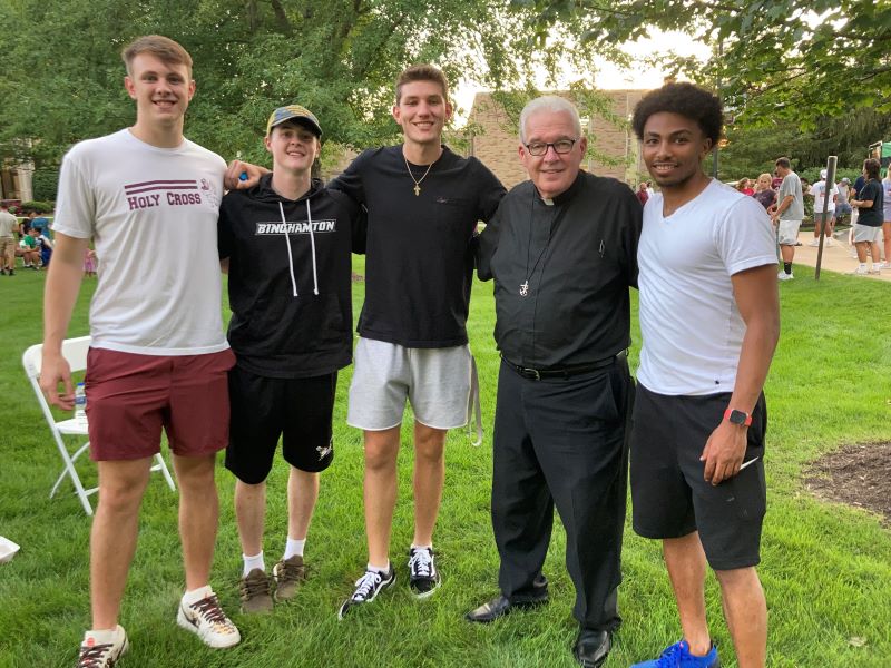 Father Tyson with students at the HoCro Nation celebration.